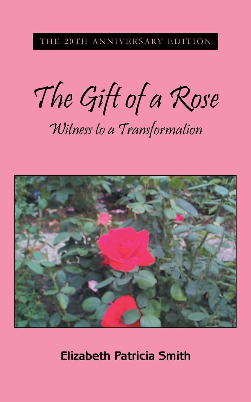cover of my first book, pink background with black print, image of a real rose surrounded by greenery in the center