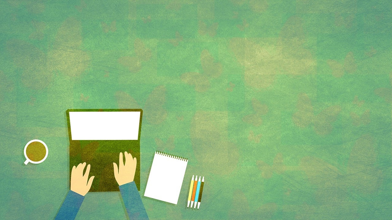 a man working on a laptop surrounded by a coffee cup, paper and colored pens, on a green background