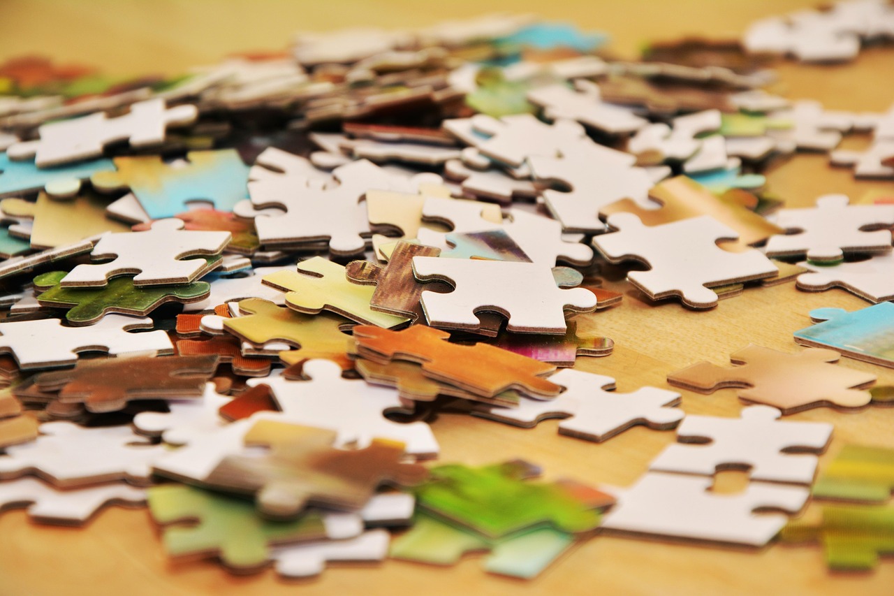 pieces of a puzzle on a flat surface